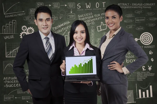 Depositphotos 34251489 Stock Photo Business People Holding Growth Graph